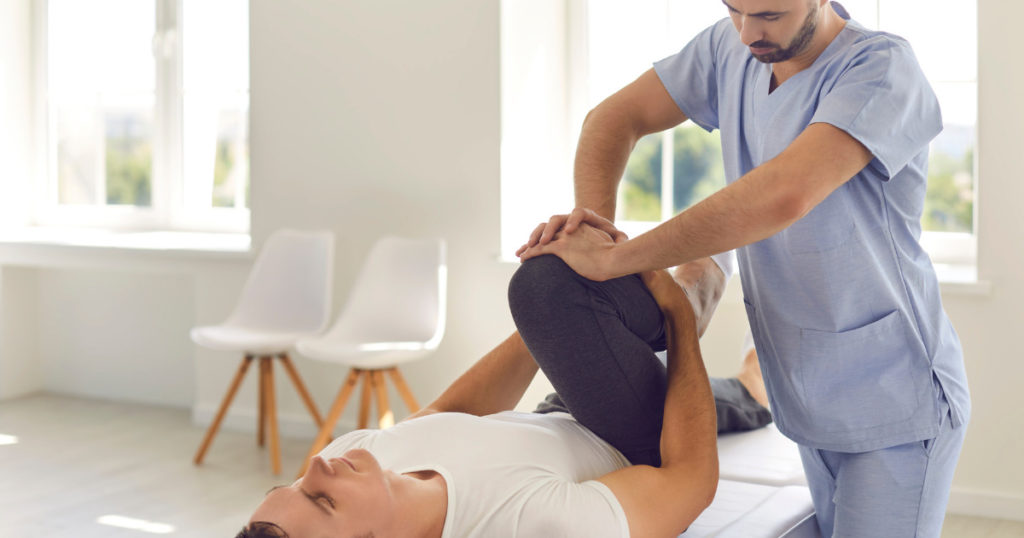 Rehabilitation staffing agency nurse helping a patient