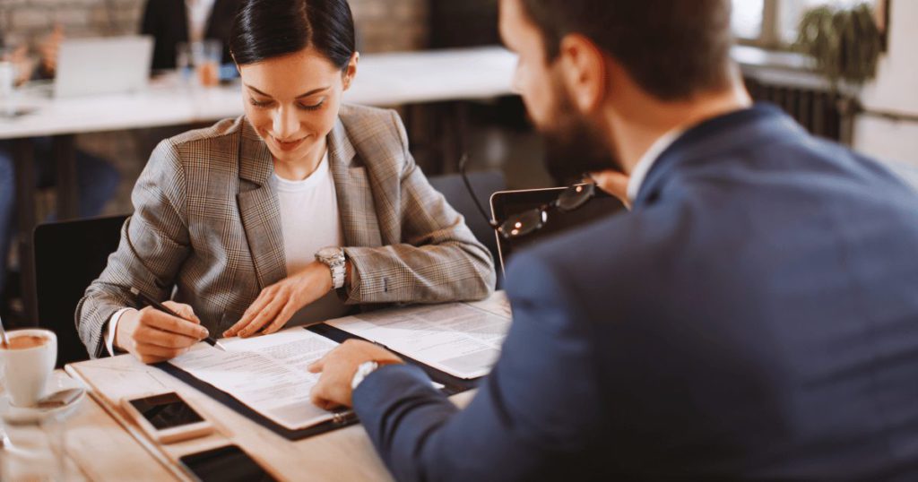 A travel nurse reviewing different travel nurse contracts