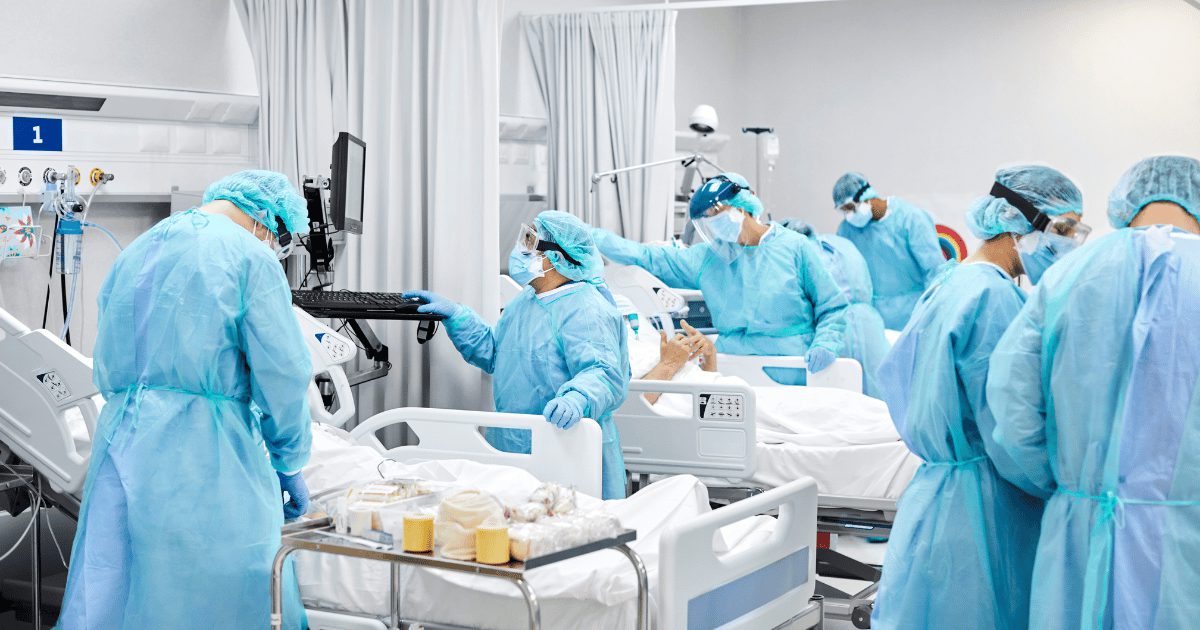 ICU nurses helping patients.