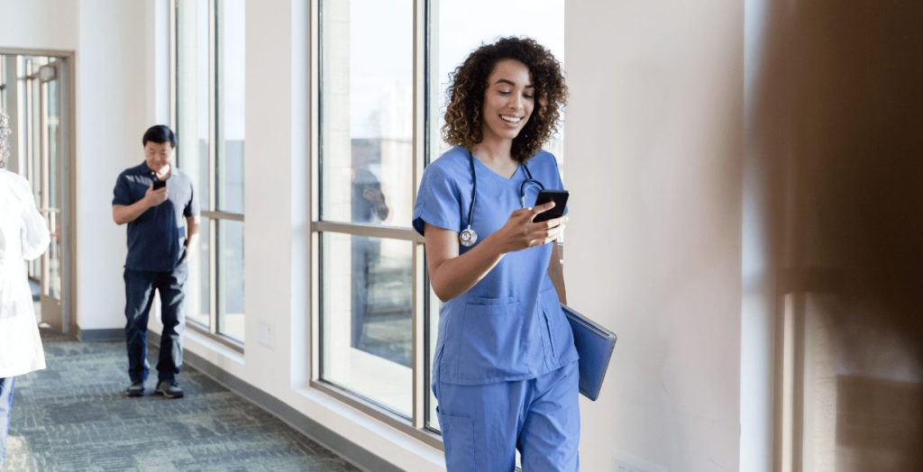 Nurses reviewing shift schedule for PRN staffing